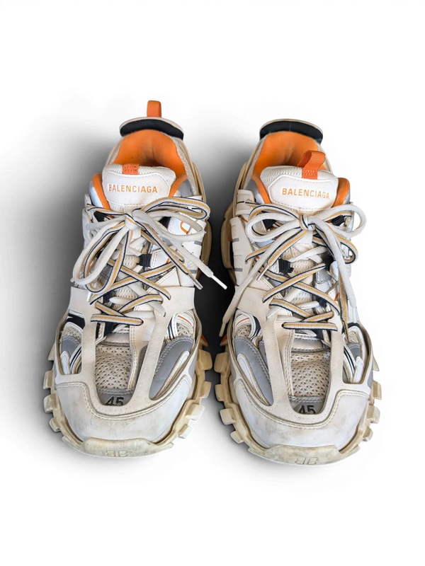 JAKE & IPI Balenciaga Track sneakers in white, grey, and orange with a rugged, layered design and size 45 detail.