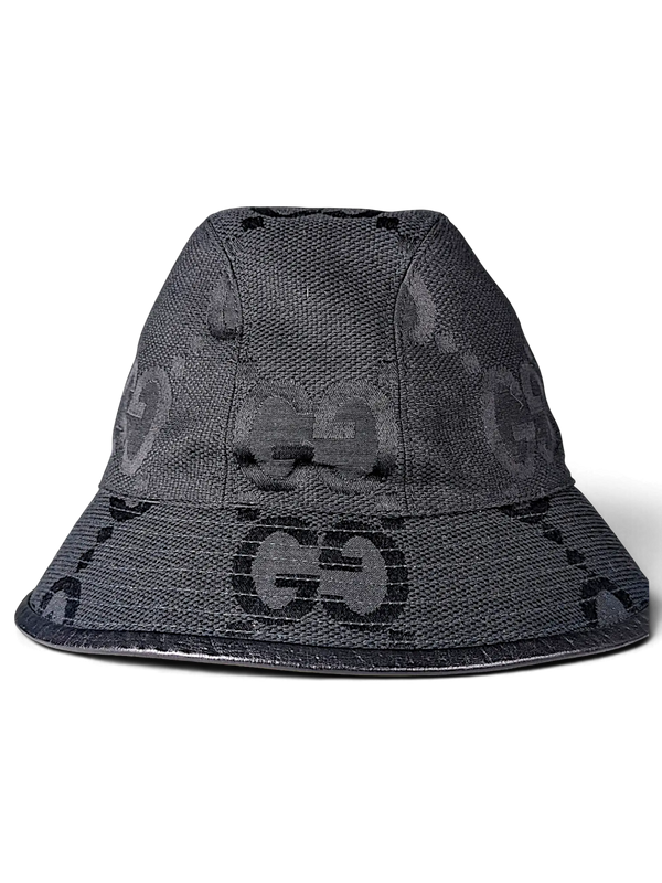 JAKE & IPI black bucket hat featuring a tonal GG monogram pattern and a structured brim.