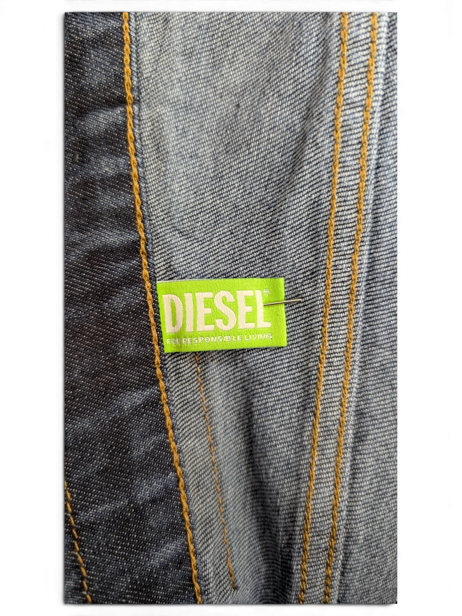 Diesel D-Fining jeans in blue denim with contrast stitching and a neon green DIESEL label.