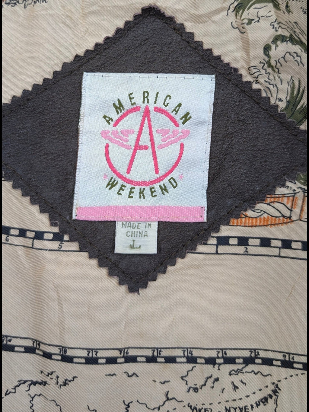 JAKE & IPI American Weekend leather jacket with a map print lining. Features a dark brown diamond-shaped panel.