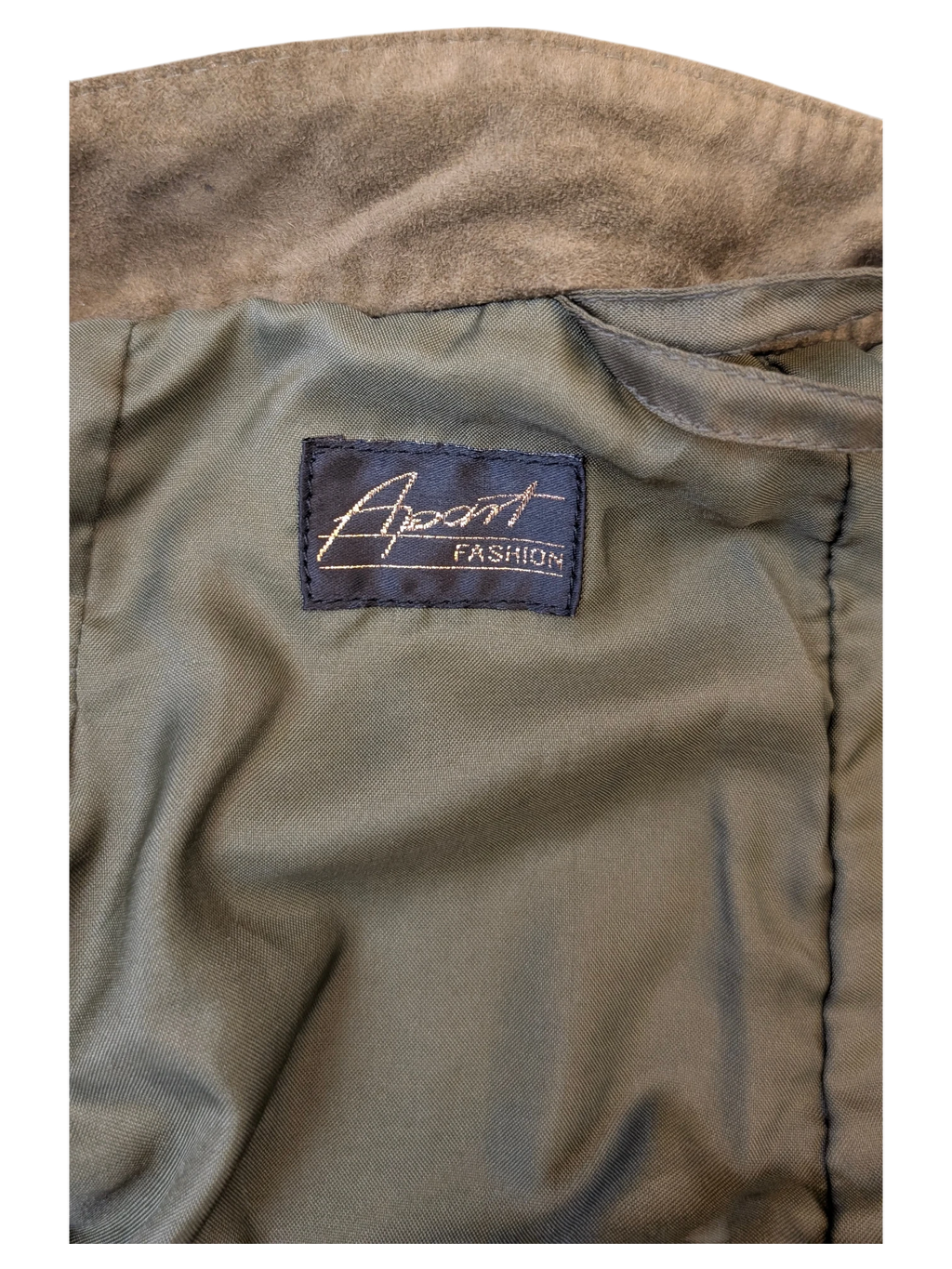 Interior label of a JAKE & IPI Apart Fashion suede skirt featuring olive green lining and soft brown suede fabric.