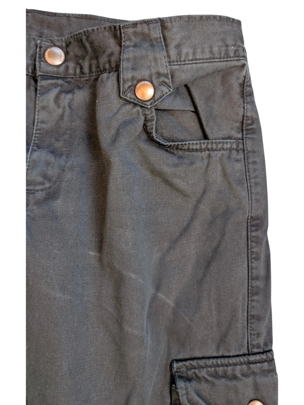JAKE & IPI black cotton cargo pants with copper button details and multiple pockets.