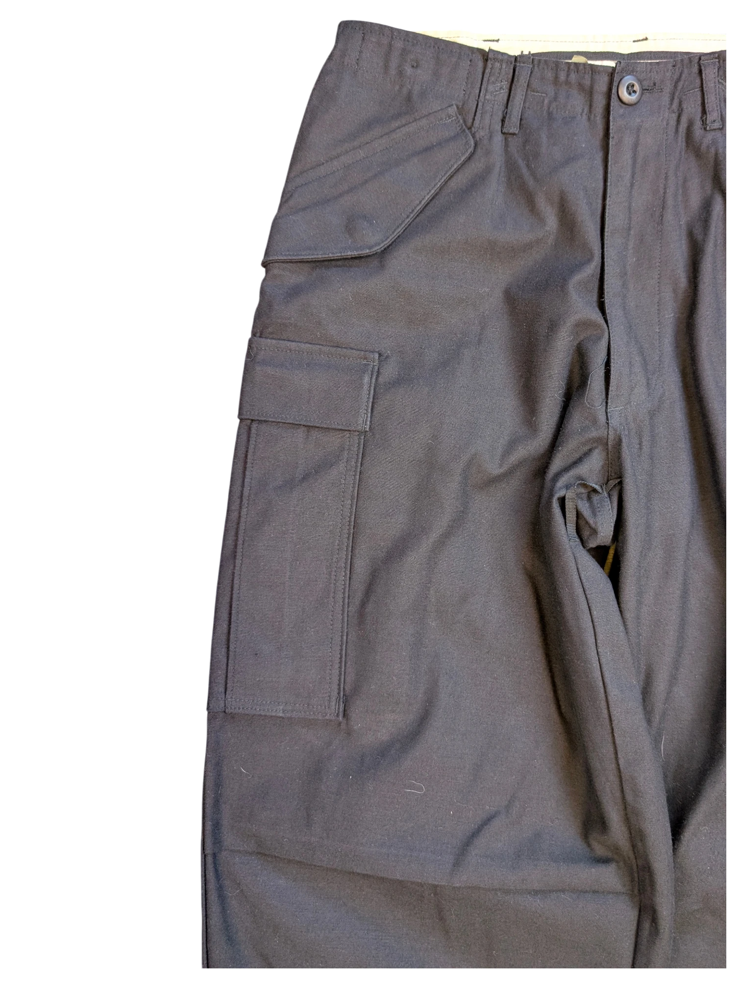 JAKE & IPI black cotton cargo pants with multiple pockets and button closure.
