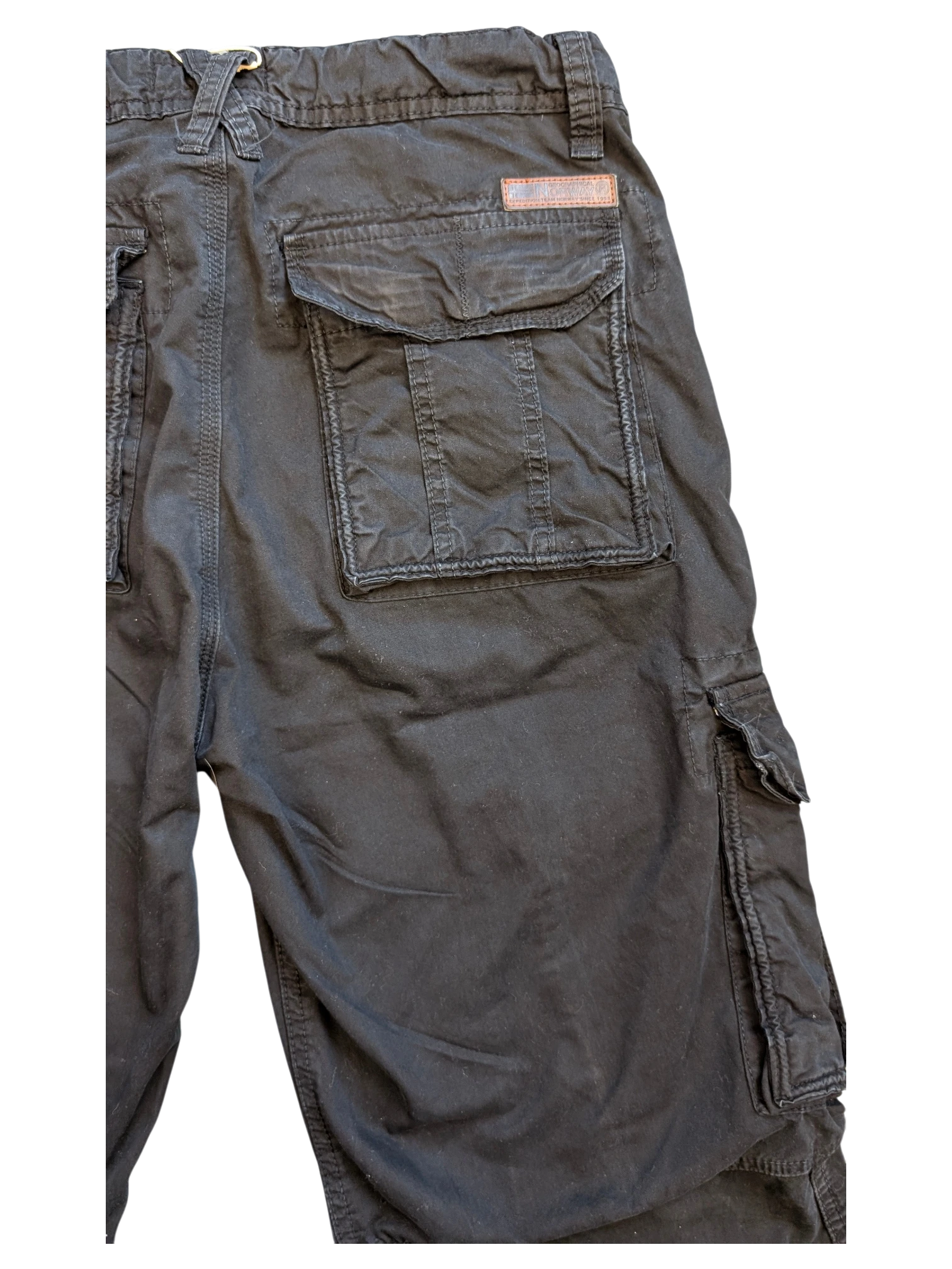 JAKE & IPI black cotton cargo pants with multiple pockets and a leather logo patch.