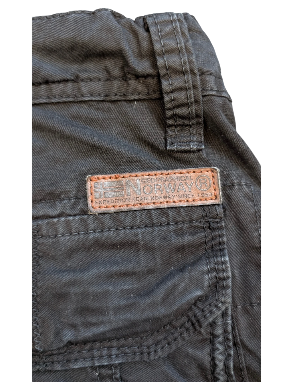 JAKE & IPI black cargo pants with a leather patch detail featuring Geographical Norway Expedition Team Since 1953.