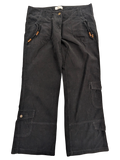 JAKE & IPI black corduroy cargo pants with wooden bead drawstring detail on pockets and button closure.