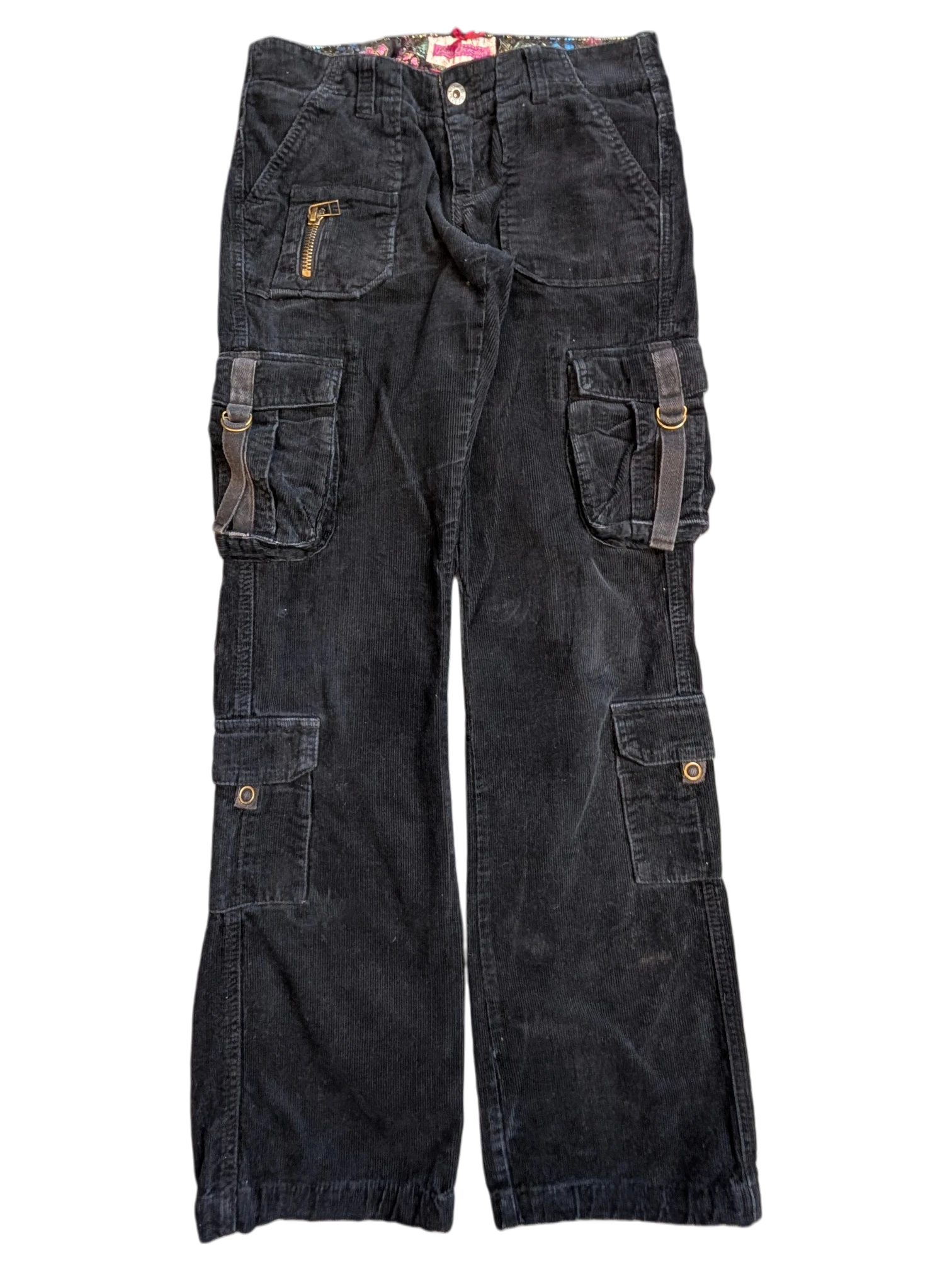 JAKE & IPI black corduroy cargo pants with multiple pockets, zip details, and adjustable straps.