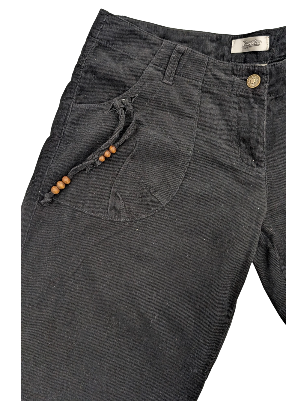 JAKE & IPI black corduroy cargo pants with drawstring detail and wooden beads.