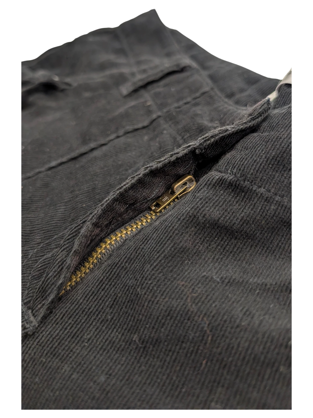 JAKE & IPI black corduroy cargo pants with brass zipper detail.