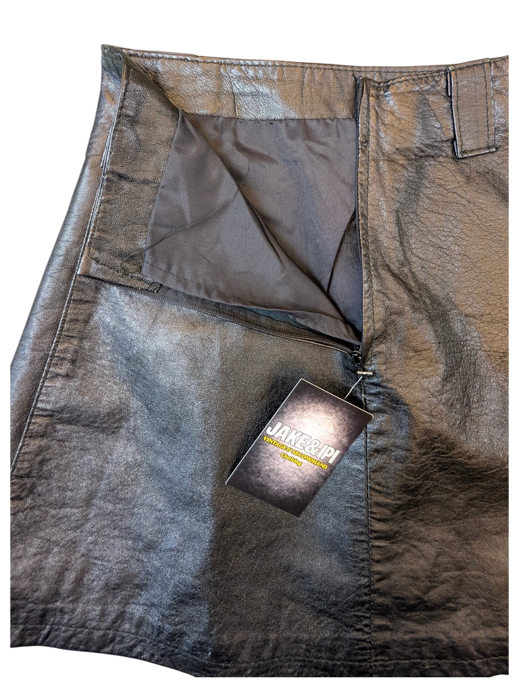 JAKE & IPI black faux leather mini skirt with a side zipper closure and fabric lining.