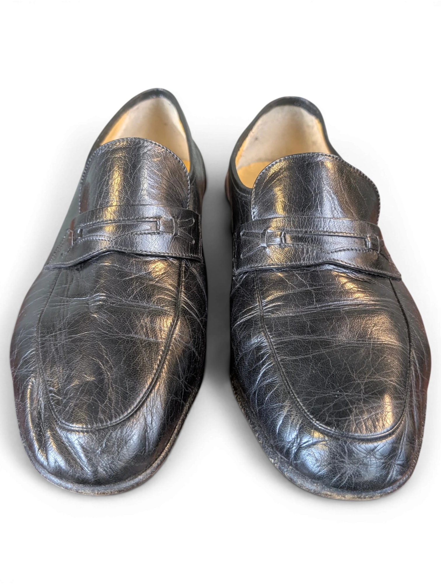 JAKE & IPI black leather penny loafers with a textured finish and classic slip-on design