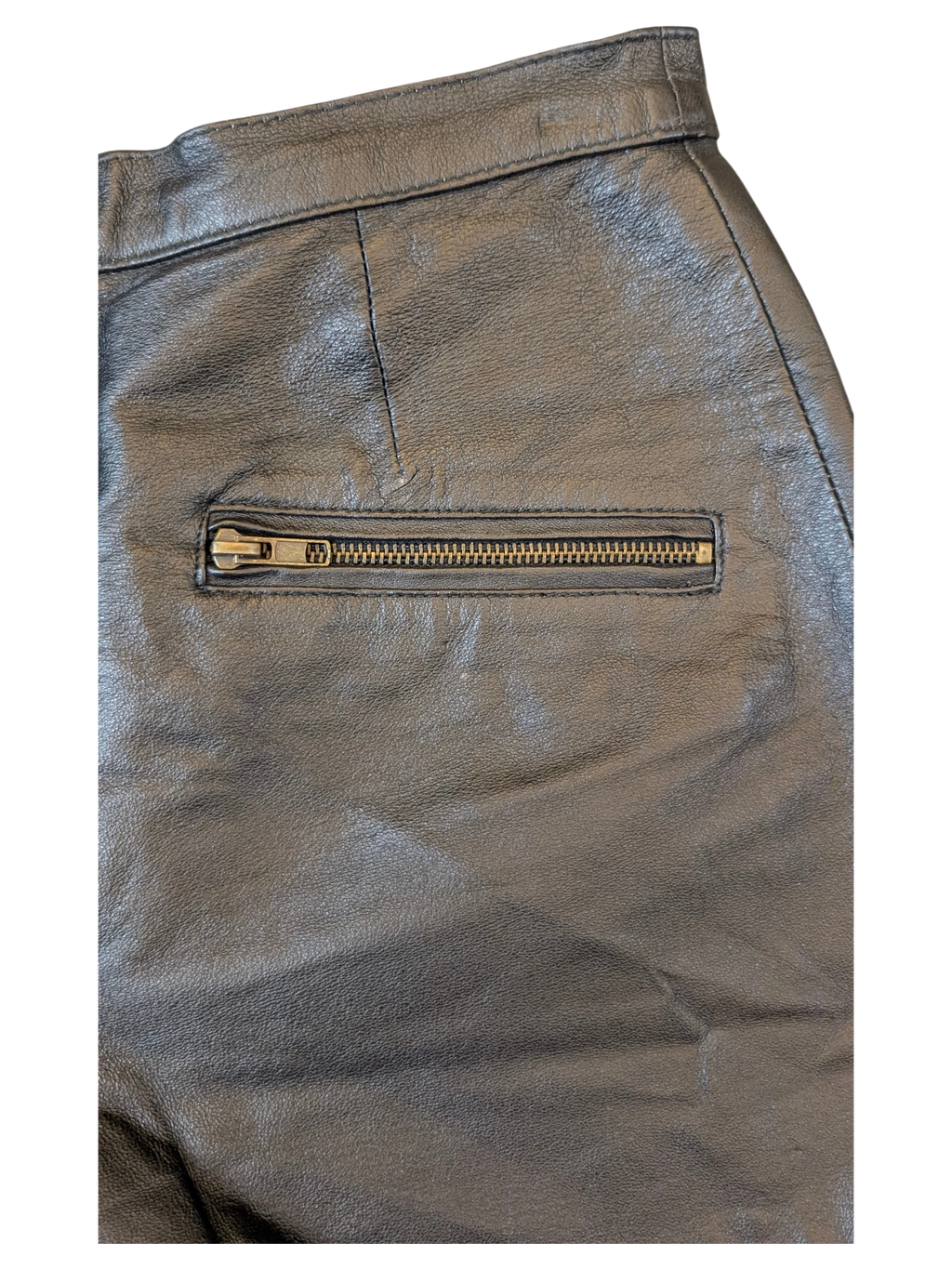 JAKE & IPI black leather shorts featuring a horizontal zippered pocket and structured waistband detailing.