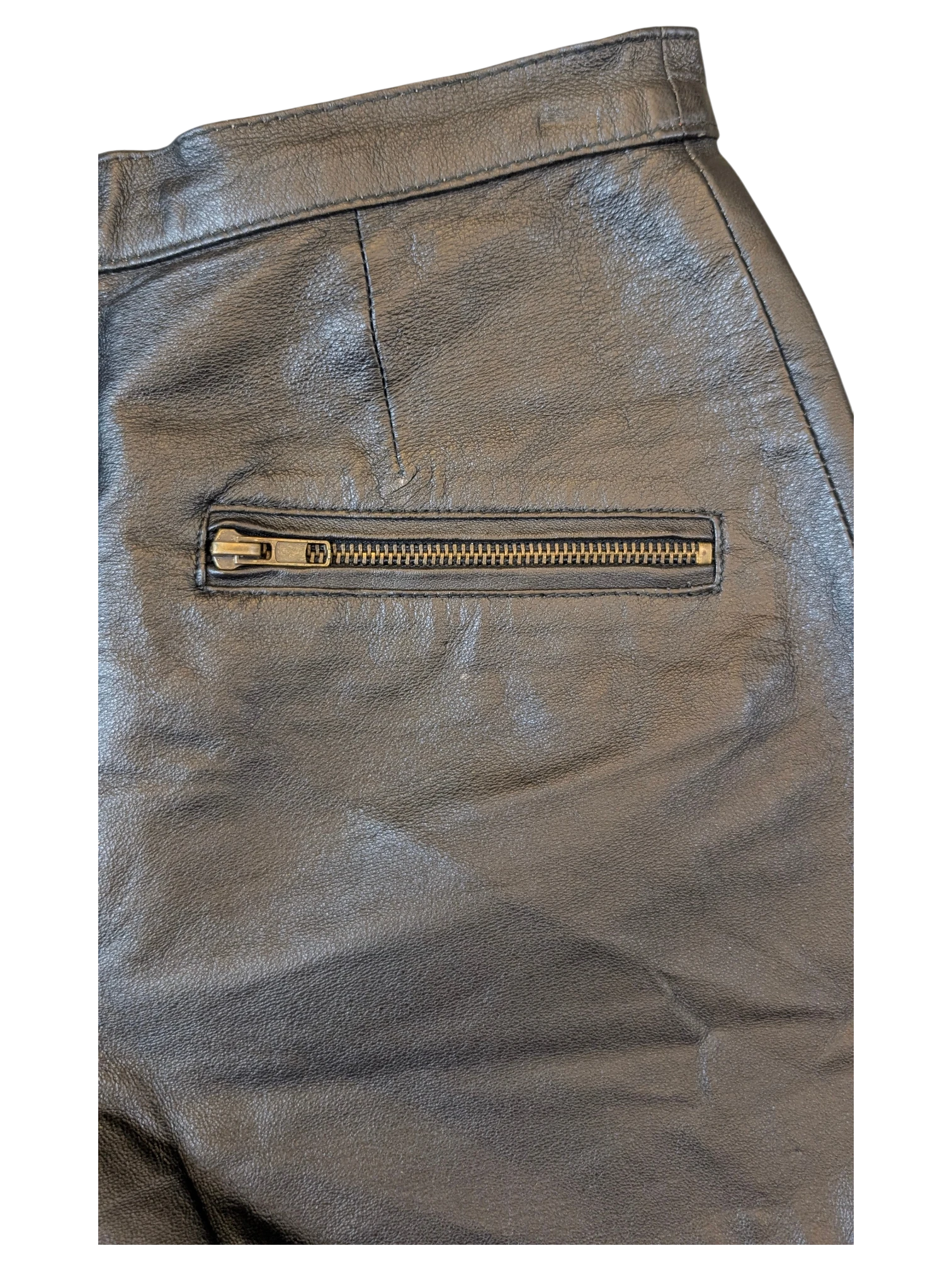 JAKE & IPI black leather shorts featuring a horizontal zippered pocket and structured waistband detailing.