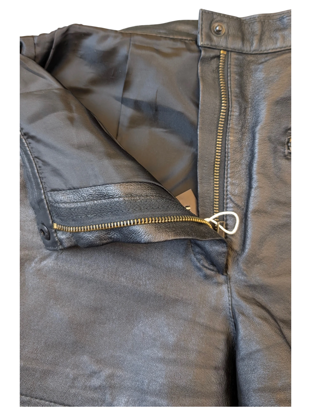 JAKE & IPI black leather shorts featuring a metal zipper fly, button closure, and smooth interior lining.