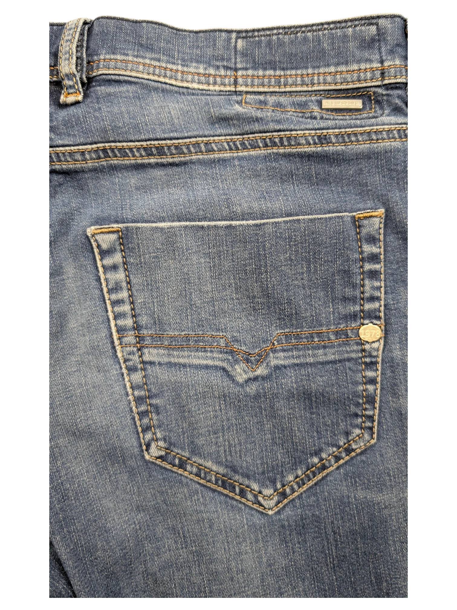 JAKE & IPI blue denim jeans with V-stitch back pocket detail and silver logo tab.