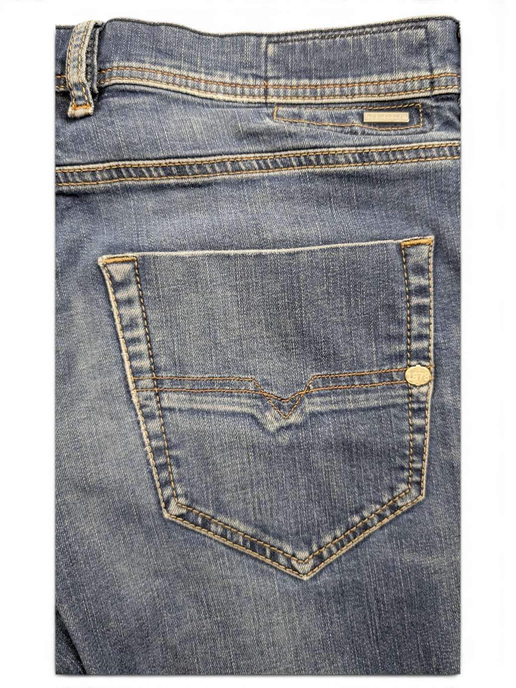 JAKE & IPI blue denim jeans with V-stitch back pocket detail and silver logo tab.
