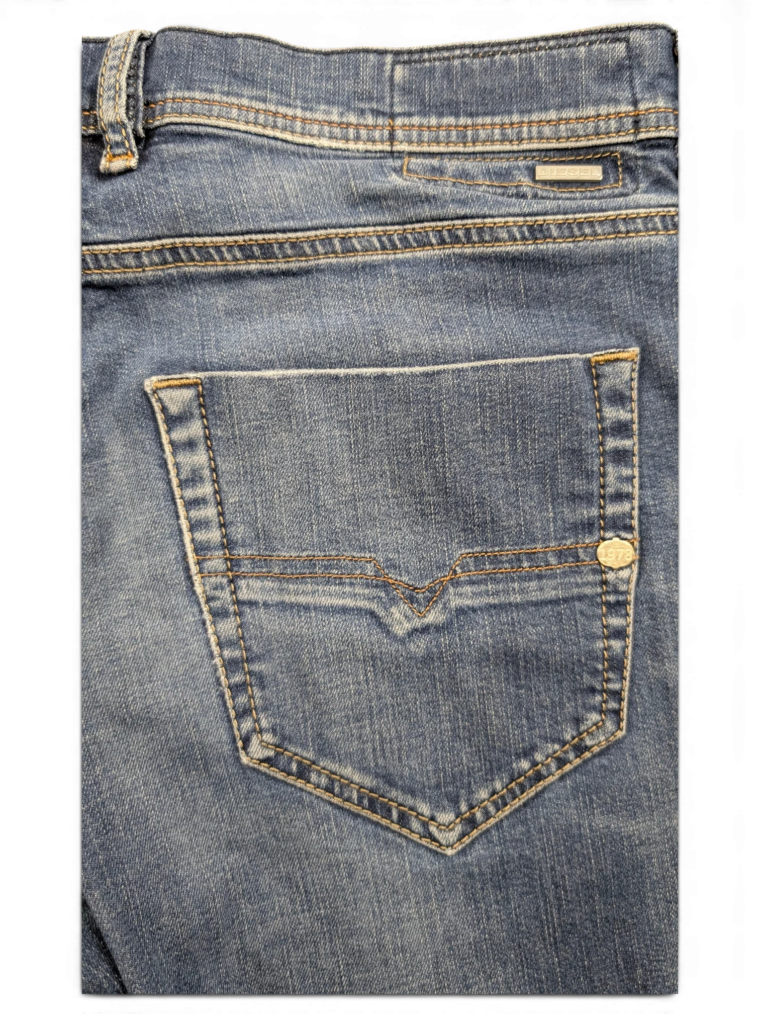 JAKE & IPI blue denim jeans with V-stitch back pocket detail and silver logo tab.