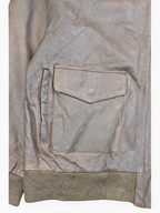 JAKE & IPI brown distressed leather bomber jacket with ribbed cuffs and a flap pocket.