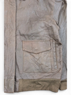 JAKE & IPI brown leather bomber jacket with ribbed cuffs and flap pocket.