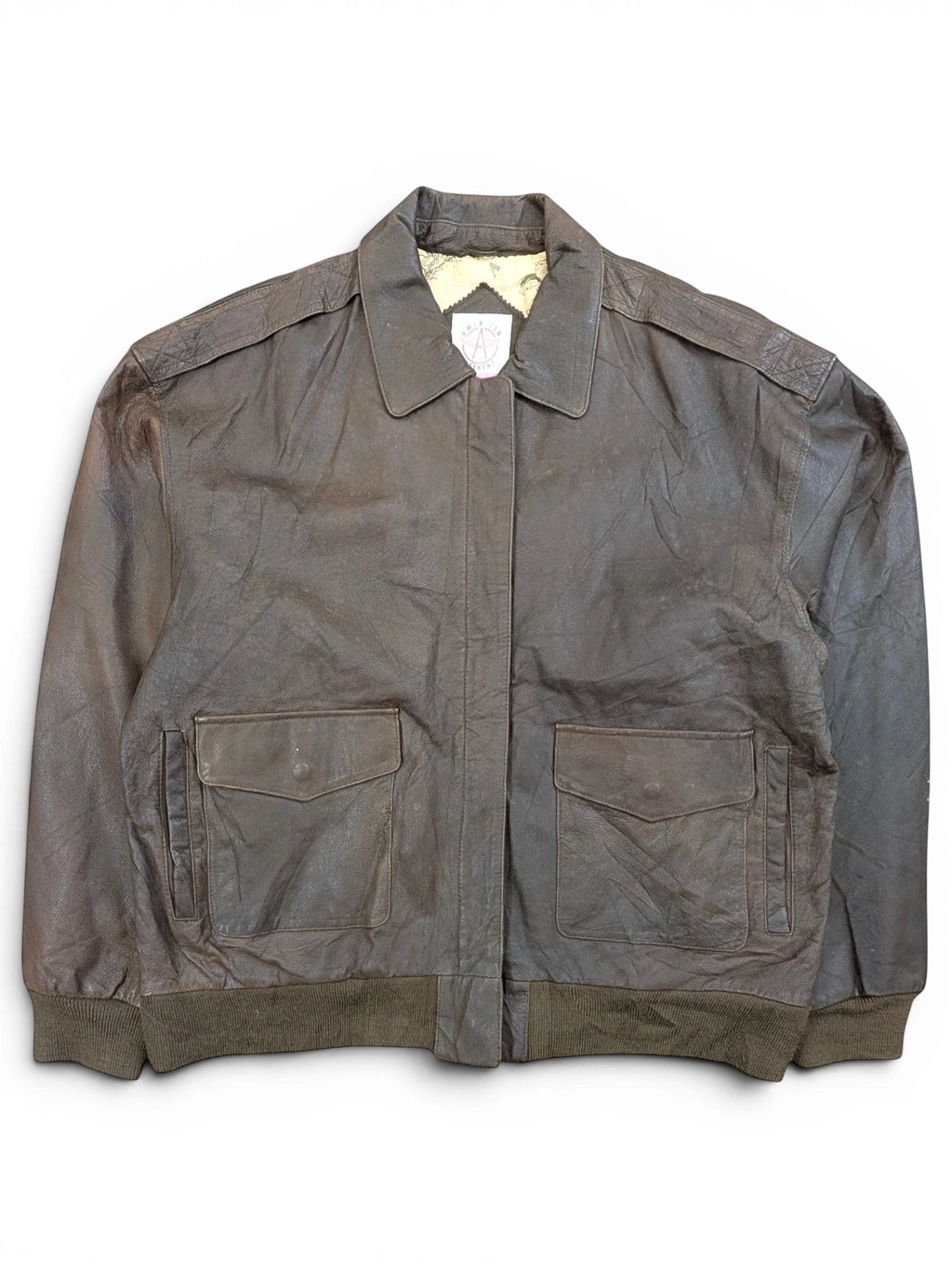 JAKE & IPI brown leather bomber jacket with button flap pockets and ribbed cuffs.