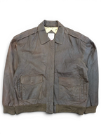 JAKE & IPI brown leather bomber jacket with button flap pockets and ribbed cuffs.