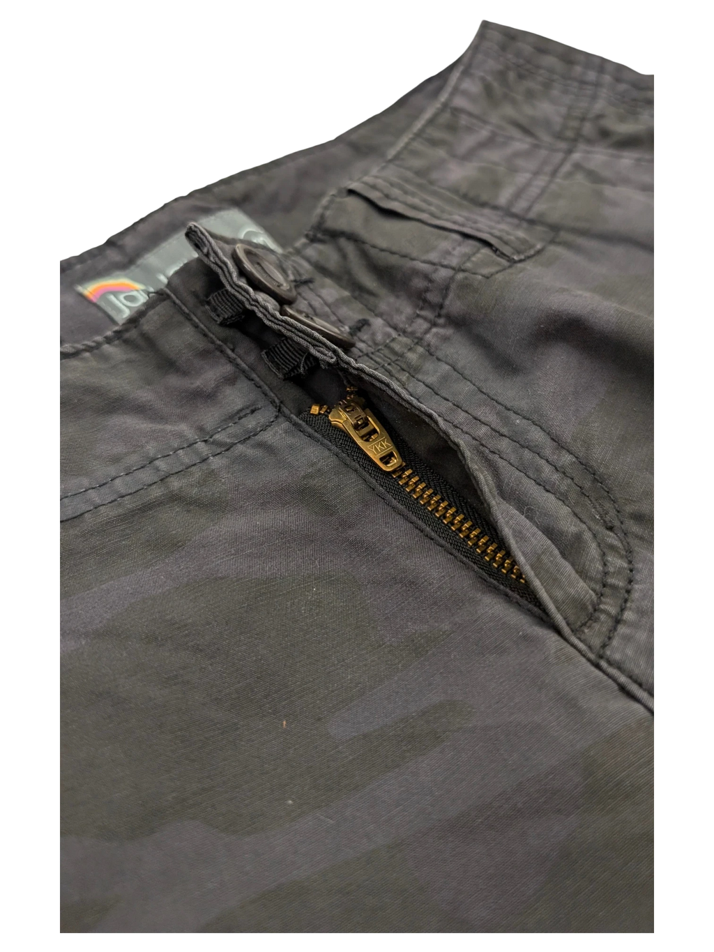 JAKE & IPI dark grey camo cargo pants with a brass zipper and button closure.