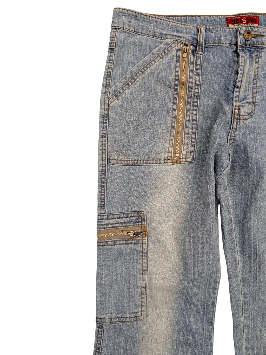 JAKE & IPI light wash denim cargo jeans with zippered pockets and diagonal front pockets.