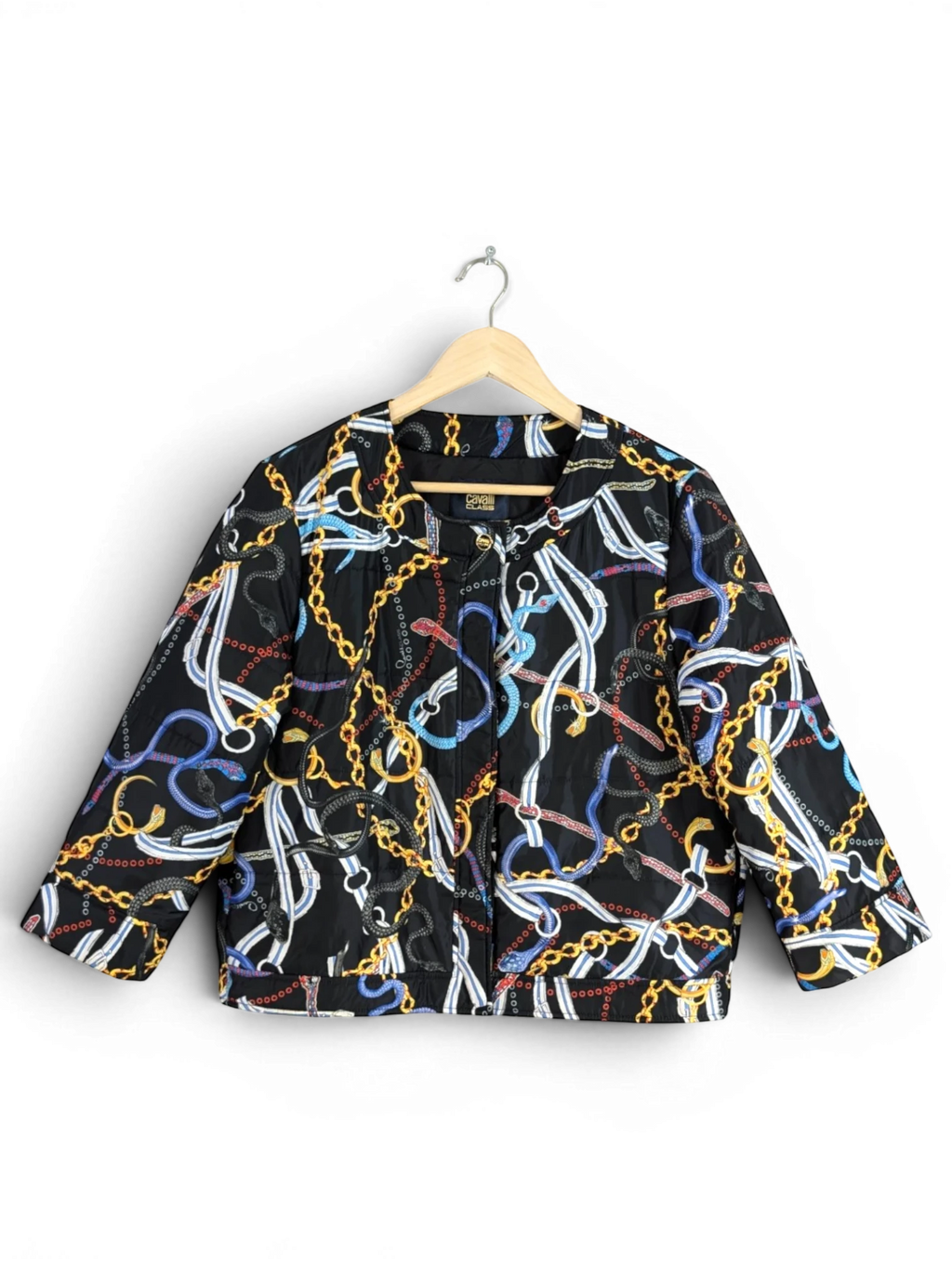 JAKE & IPI Cavalli Class black quilted cropped jacket with gold chain and multicolour snake print. Features gold logo buttons.