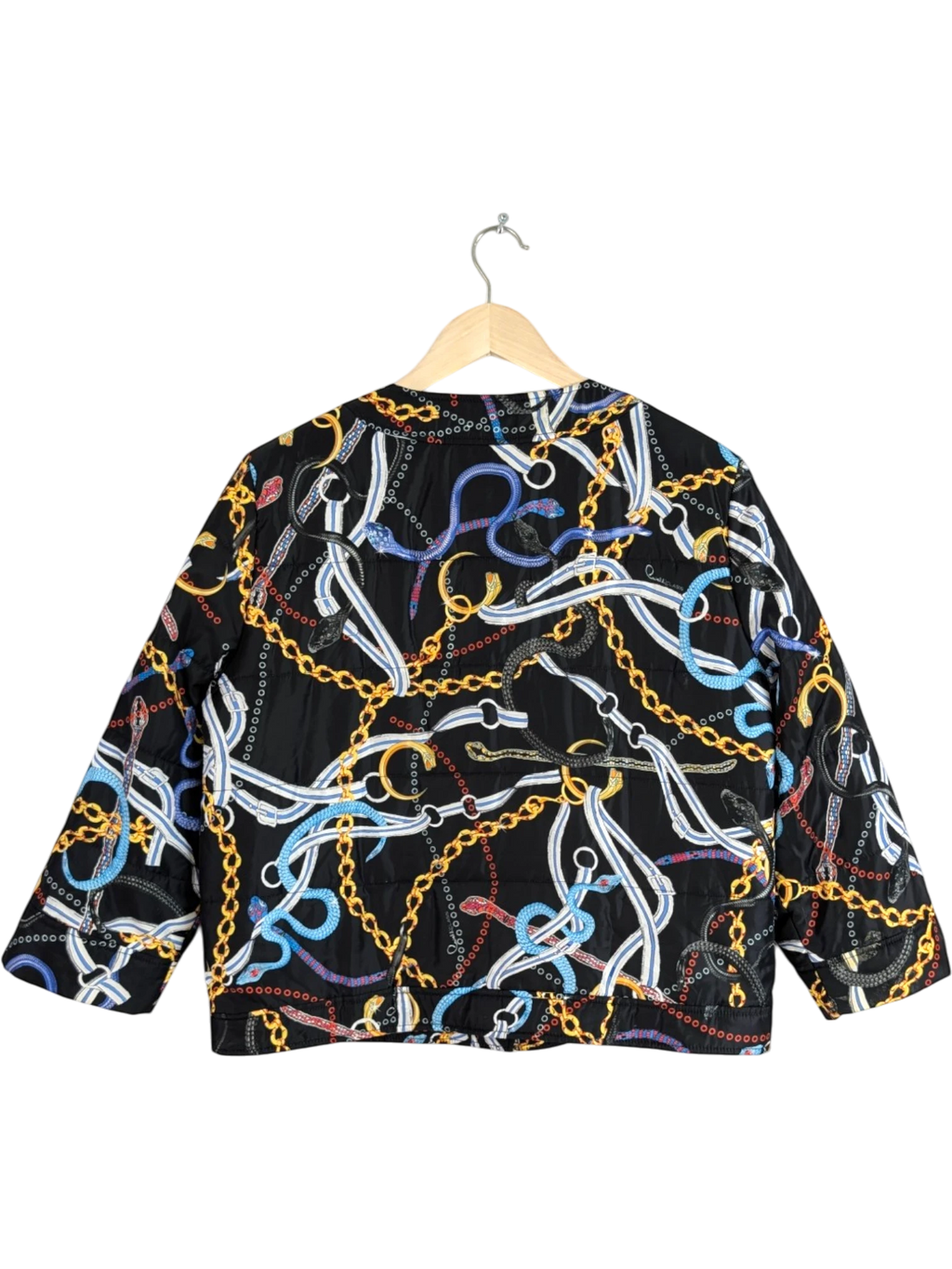 JAKE & IPI black cropped jacket with gold chains and multicolour snake print, quilted construction.