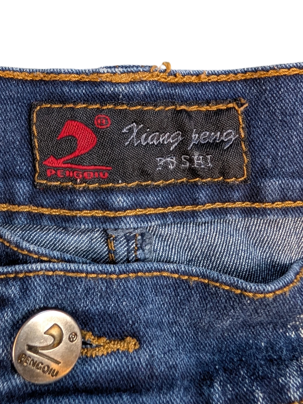 JAKE & IPI blue denim cargo pants with orange stitching and branded button.