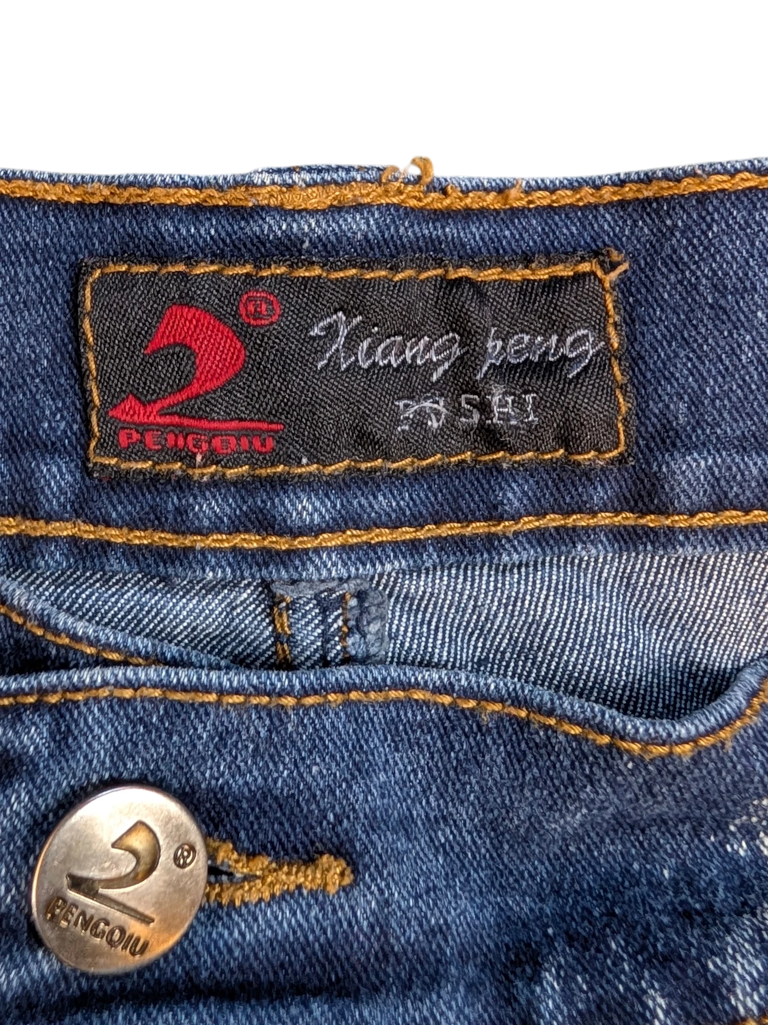 JAKE & IPI blue denim cargo pants with orange stitching and branded button.