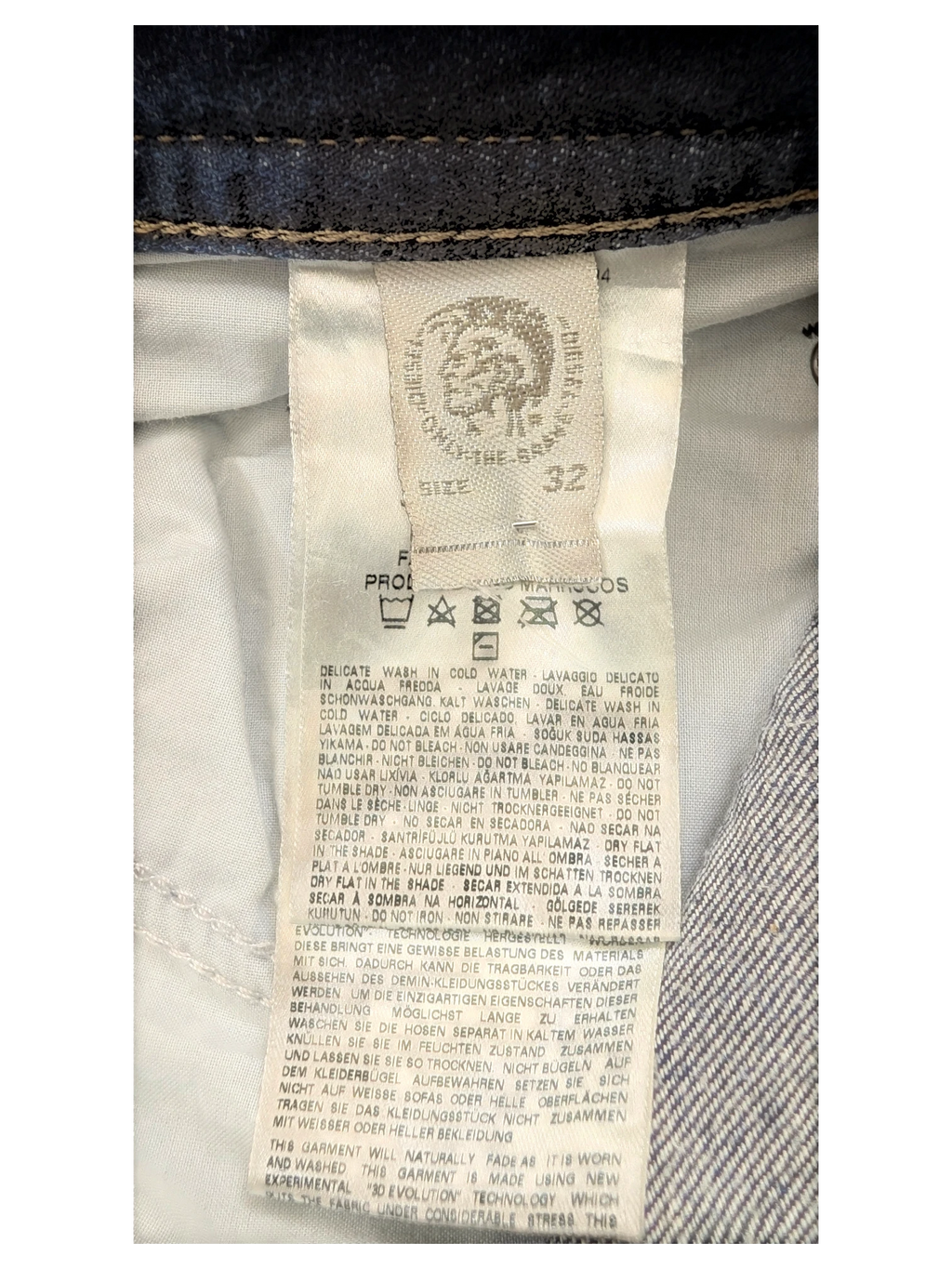 JAKE & IPI Diesel Buster jeans size 32, dark wash denim with care instructions and brand logo.