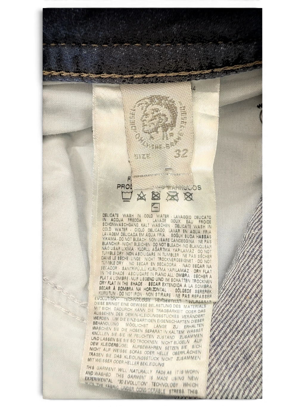 JAKE & IPI Diesel Buster jeans size 32, dark wash denim with care instructions and brand logo.