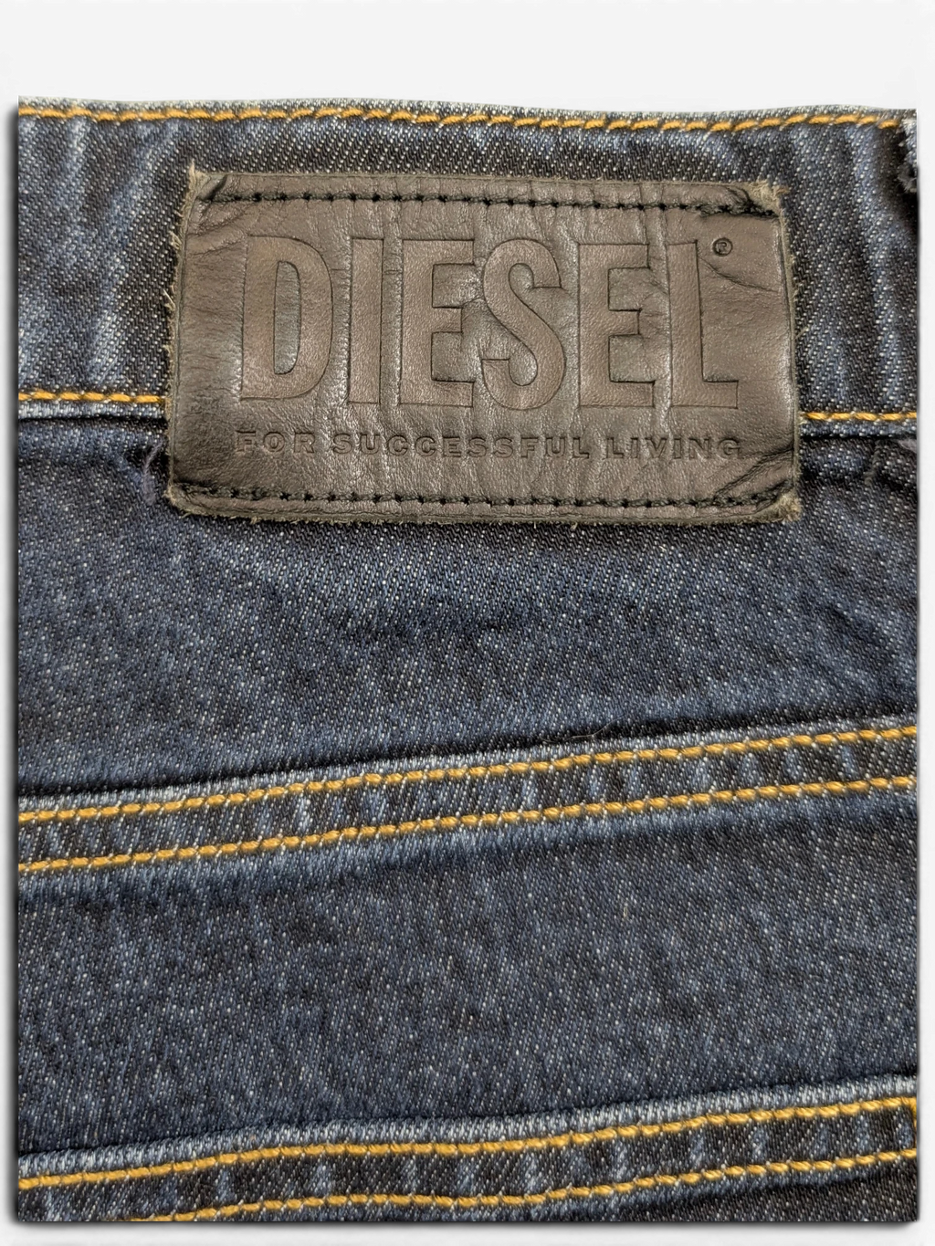 JAKE & IPI Diesel D-Fining dark wash denim jeans with leather logo patch and contrast stitching.