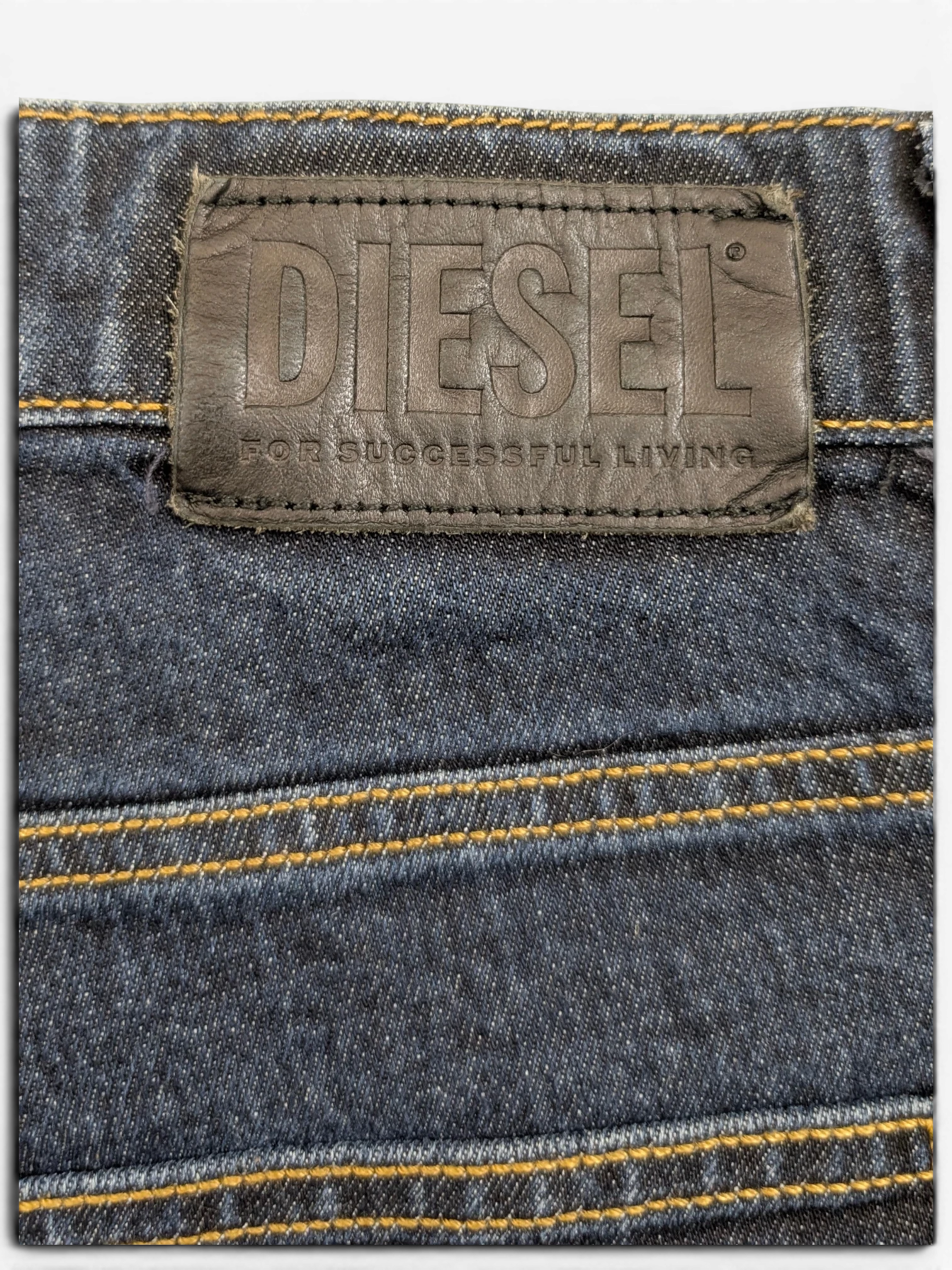 JAKE & IPI Diesel D-Fining dark wash denim jeans with leather logo patch and contrast stitching.