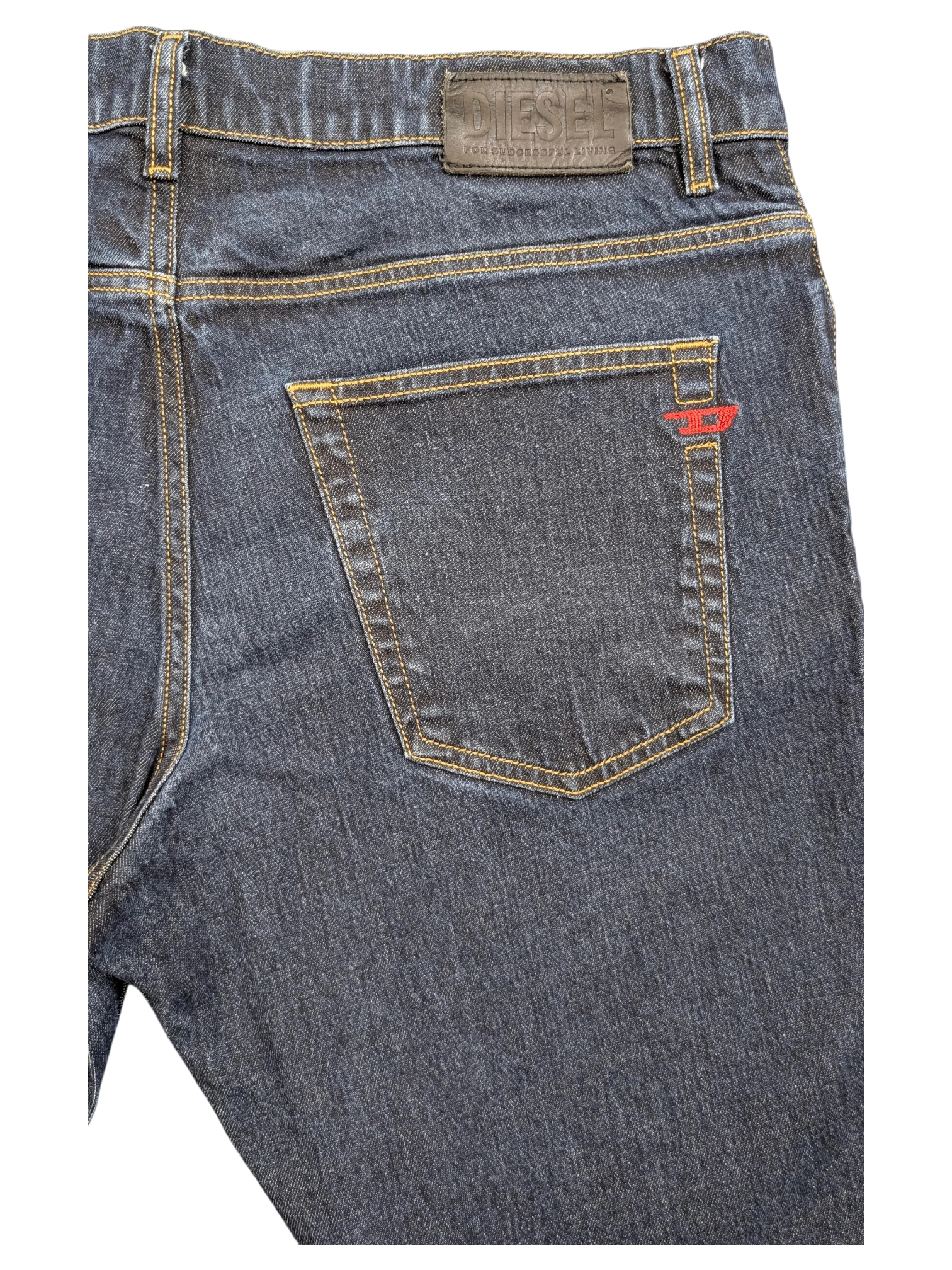 JAKE & IPI dark wash denim jeans with red Diesel logo detail on back pocket and leather brand patch.