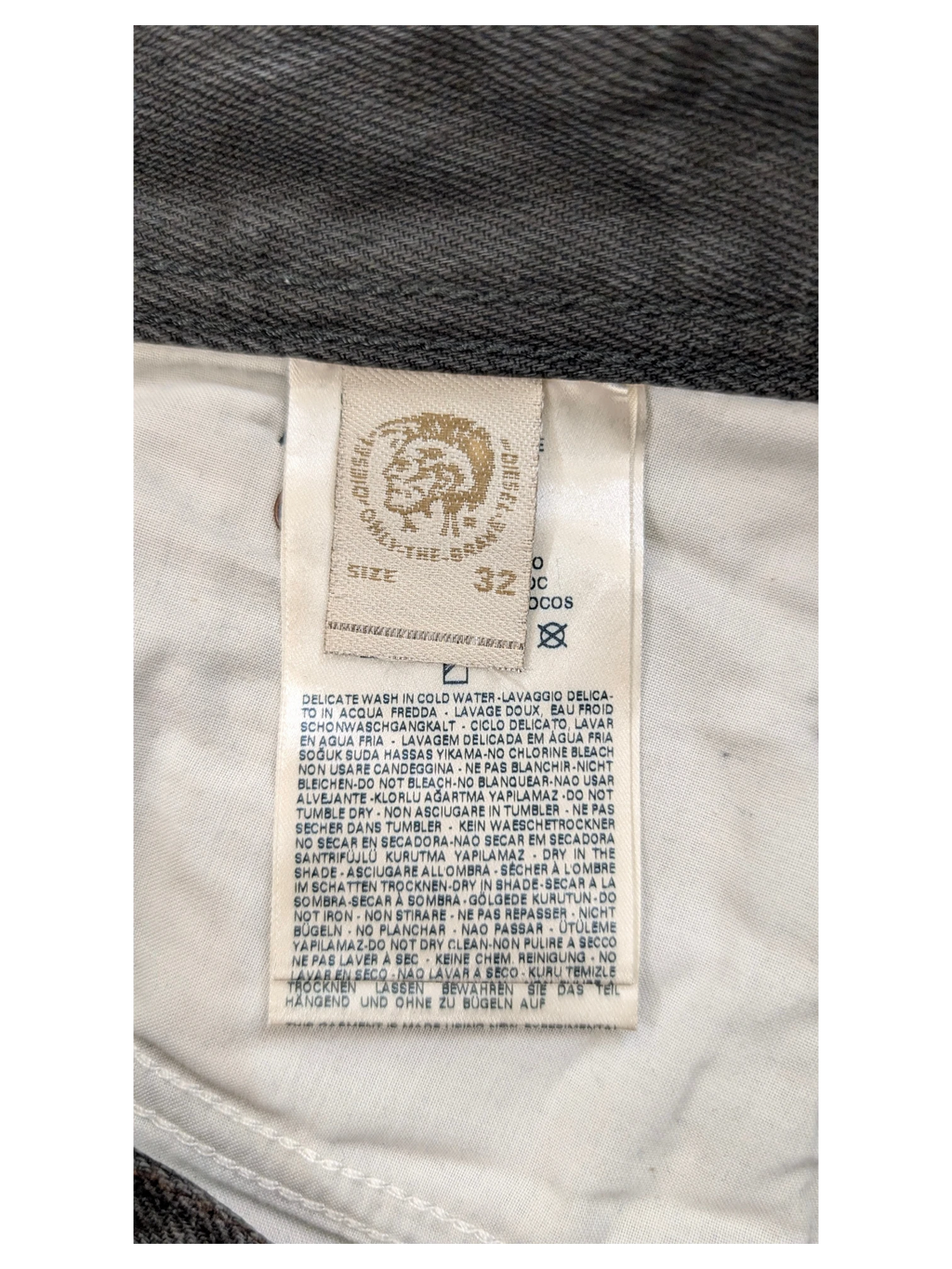 JAKE & IPI Diesel jeans size 32 with care instructions label.
