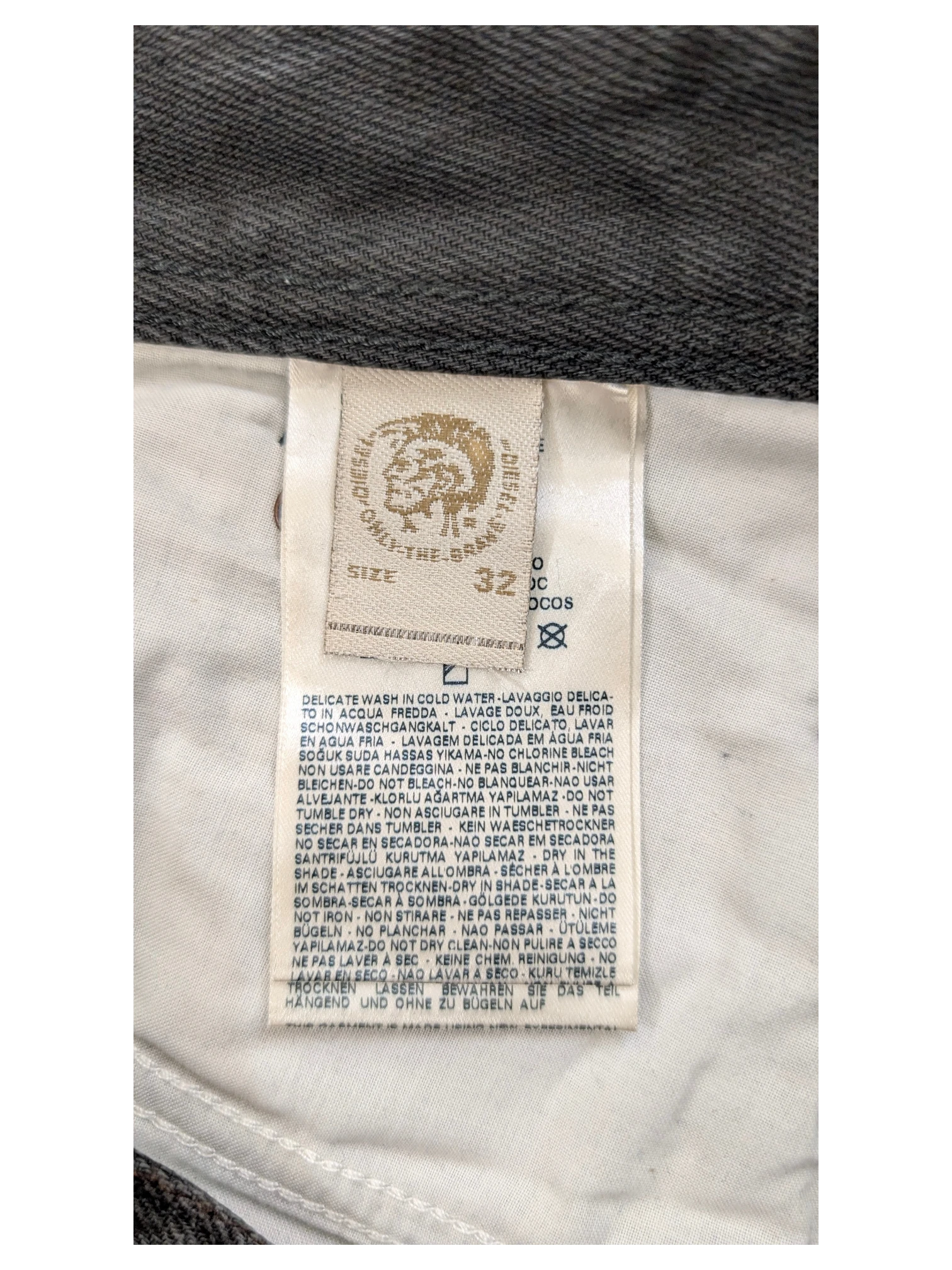 JAKE & IPI Diesel jeans size 32 with care instructions label.