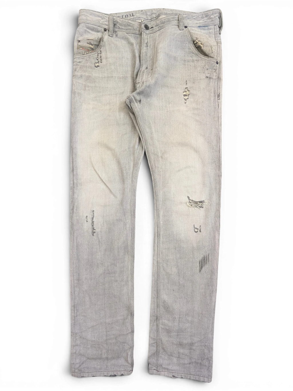 JAKE & IPI light wash distressed denim jeans with ripped details and a relaxed fit.