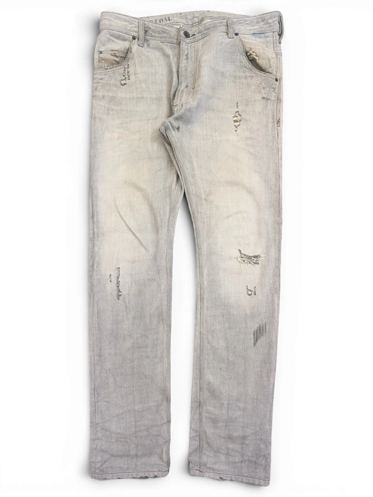 JAKE & IPI light wash distressed denim jeans with ripped details and a relaxed fit.