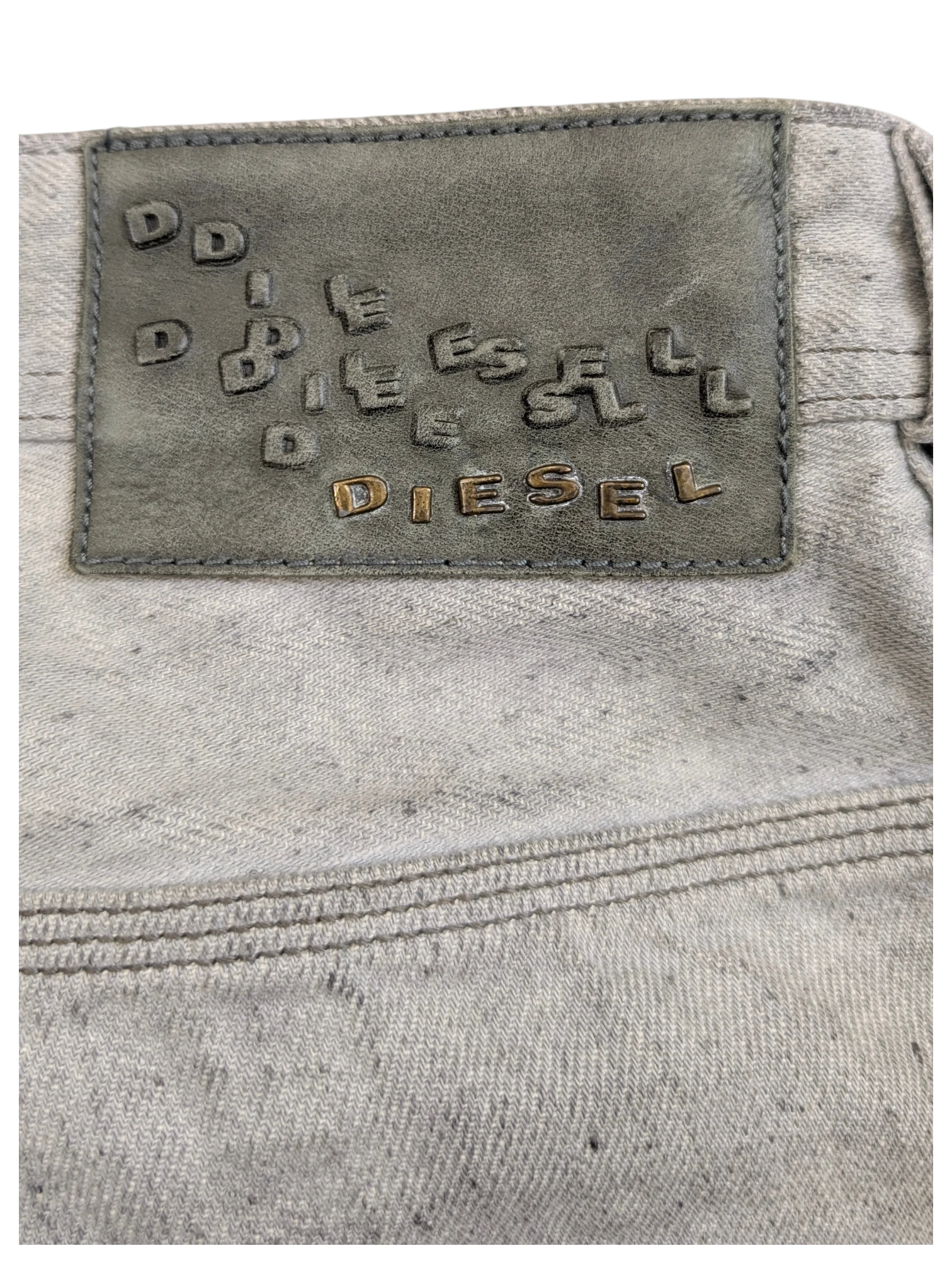 JAKE & IPI light grey Diesel Krooley jeans with embossed leather patch and double stitching detail.