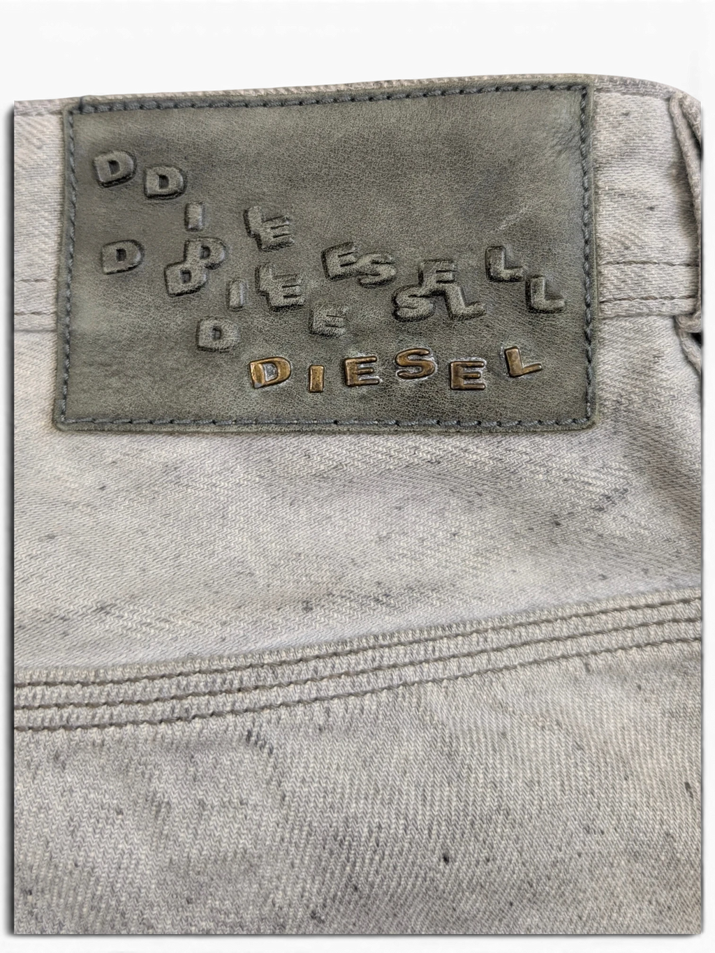 JAKE & IPI light grey Diesel Krooley jeans with embossed leather patch and double stitching detail.