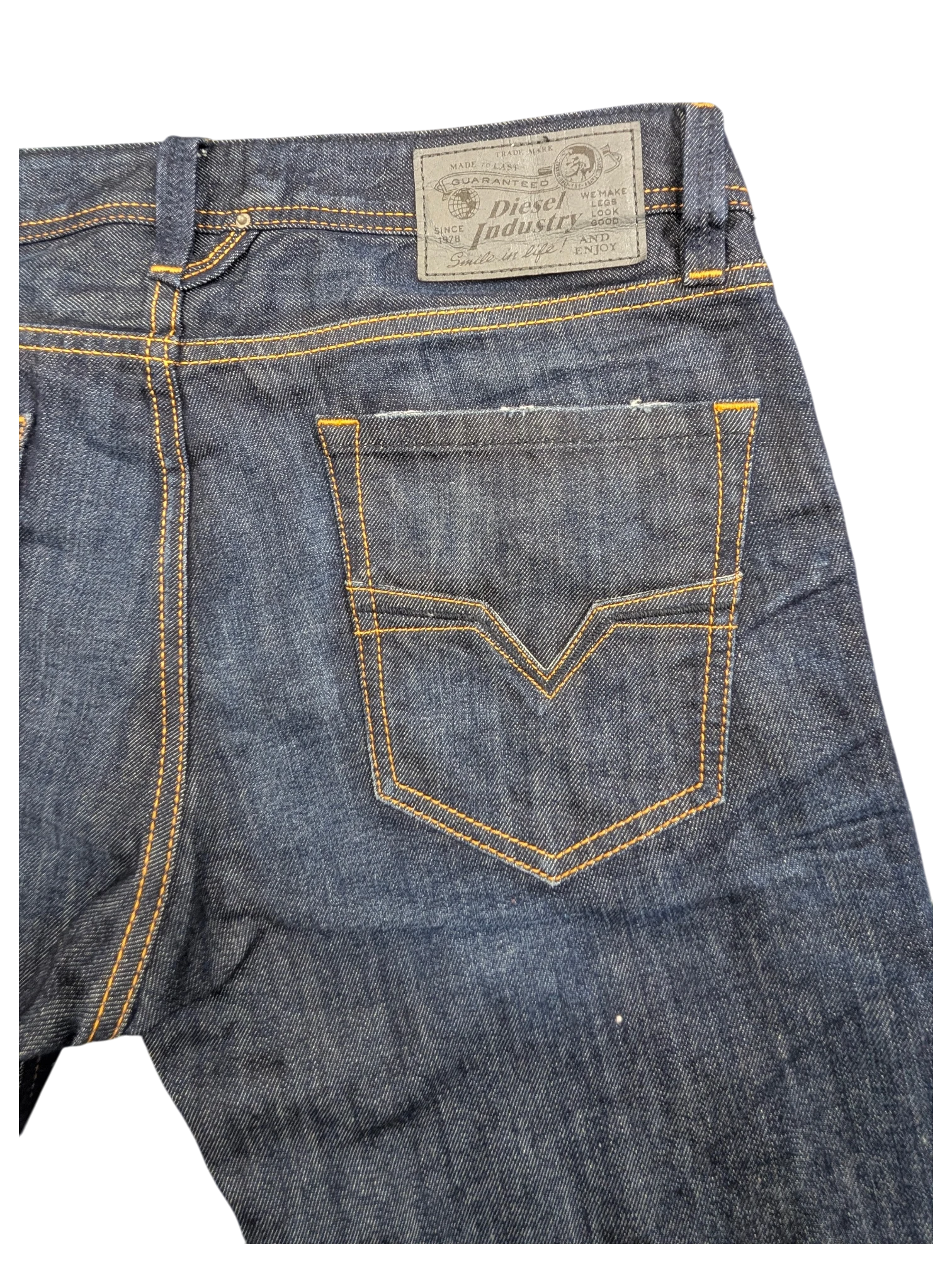 JAKE & IPI Diesel Larkee dark wash denim jeans with orange stitching and V-shaped back pocket detail.