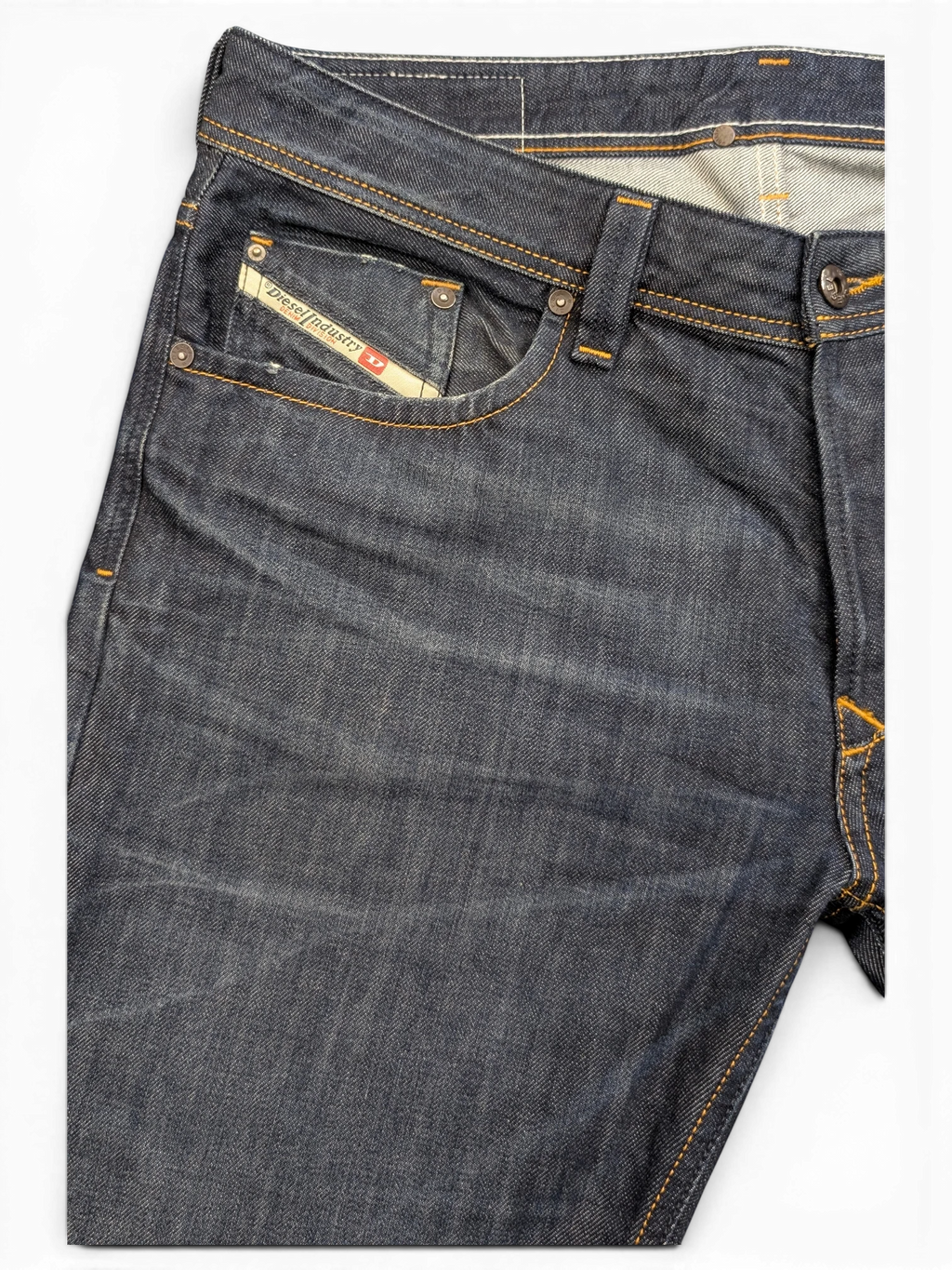 JAKE & IPI Diesel Larkee dark wash denim jeans with orange stitching and signature pocket tag.