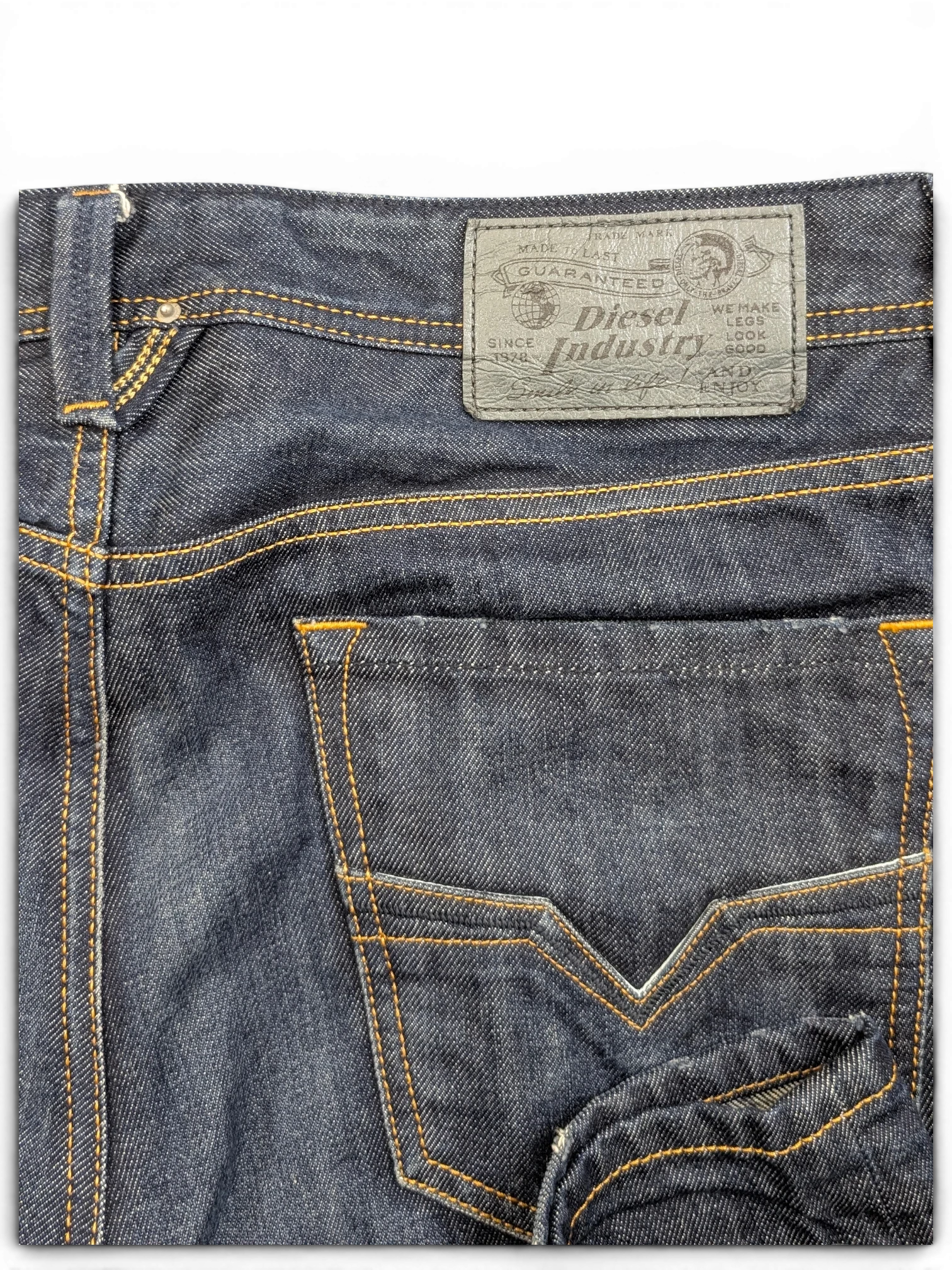 JAKE & IPI Diesel Larkee dark wash denim jeans with orange stitching and leather logo patch.