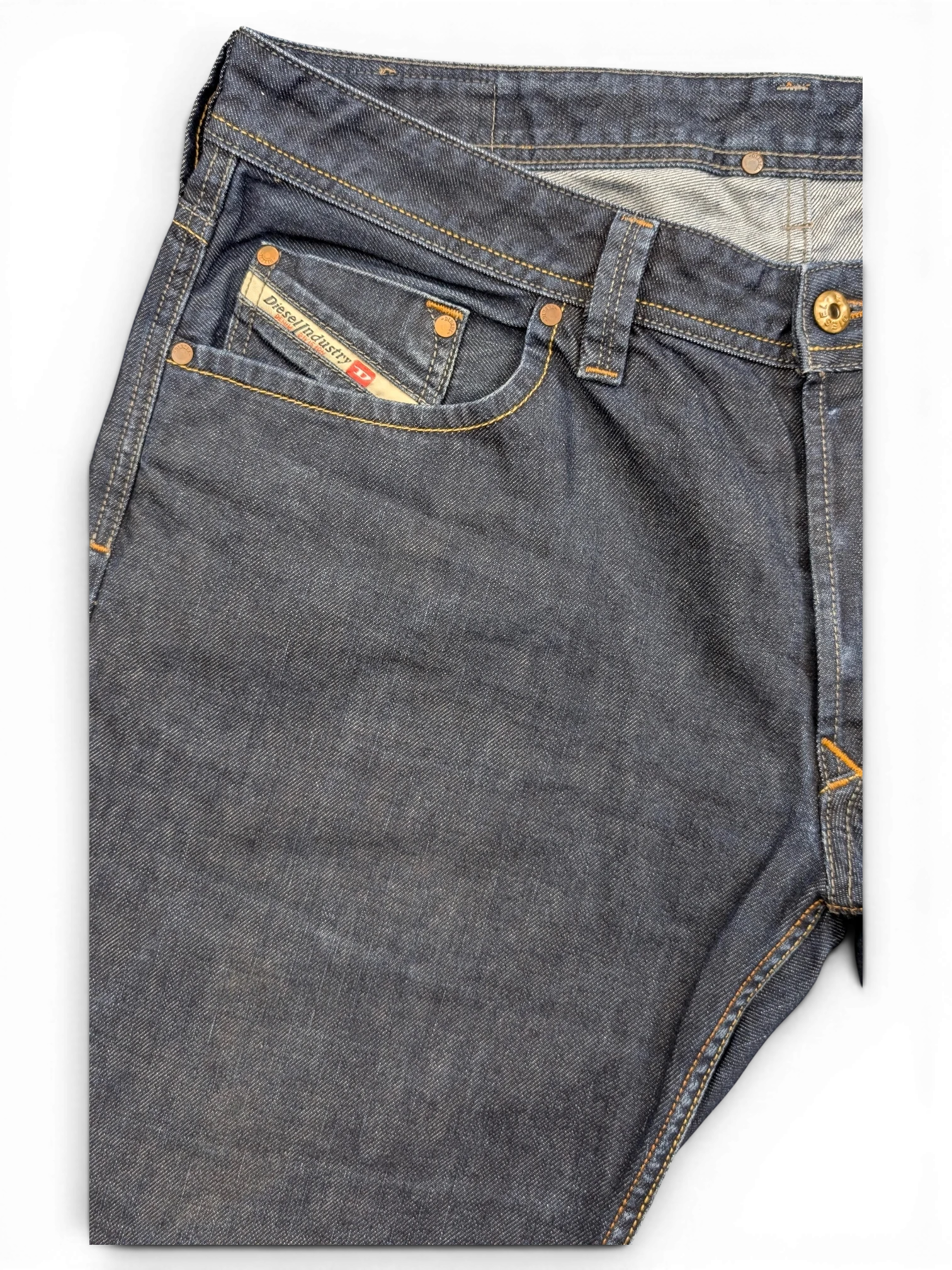 JAKE & IPI Diesel Larkee dark wash denim jeans with copper stitching and signature pocket logo.