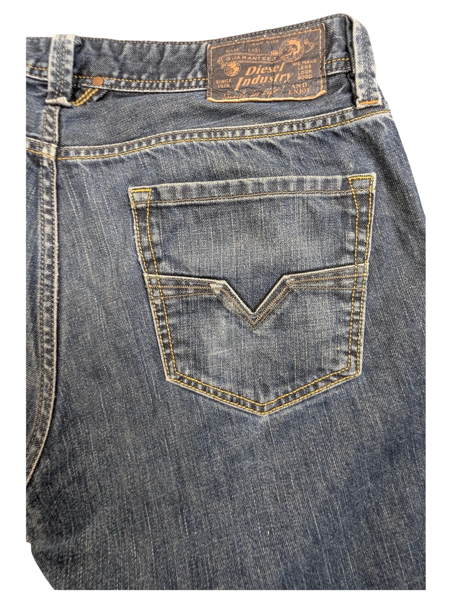 JAKE & IPI Diesel Larkee men's blue denim jeans with V-stitch back pockets and contrast yellow stitching.