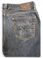 JAKE & IPI Diesel Larkee men's blue denim jeans with V-stitch back pockets and contrast yellow stitching.