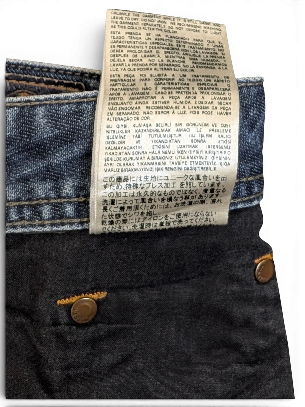 JAKE & IPI Diesel Larkee W34 L30 dark wash denim jeans with copper button details.