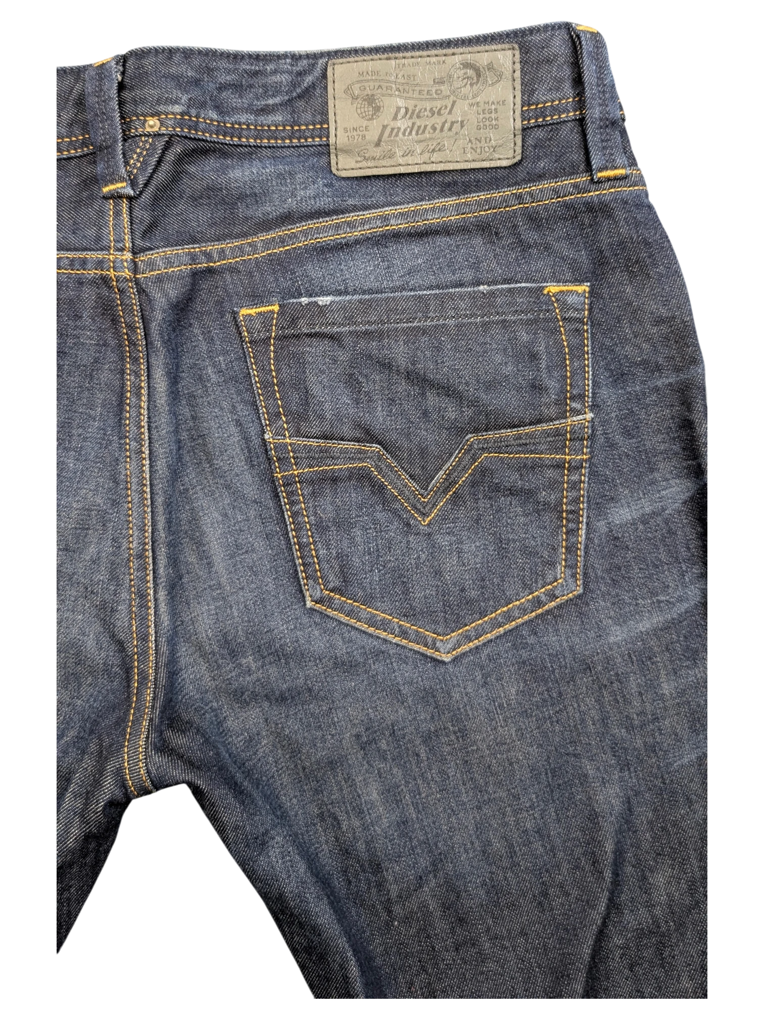 JAKE & IPI Diesel Larkee dark wash denim jeans with yellow stitching and V-shaped back pocket detail.
